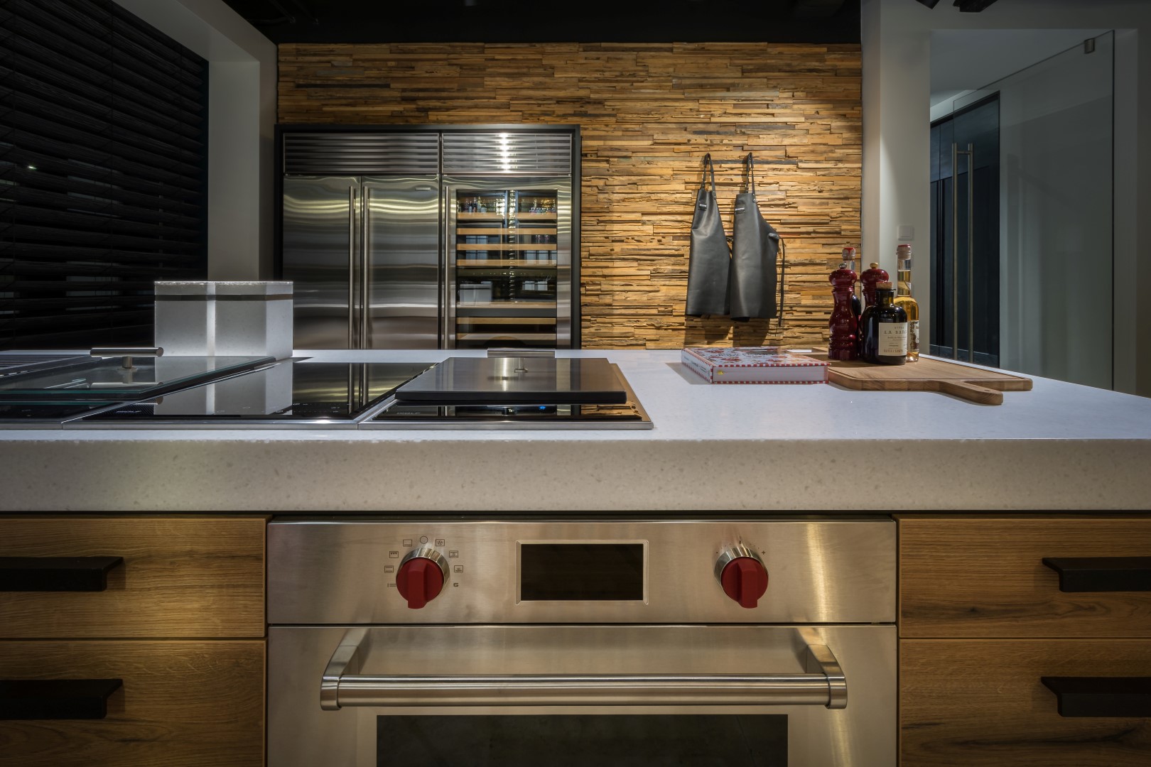 Cooking element from Wolf in luxury kitchen with cooking island and kitchen worktop from Himacs.